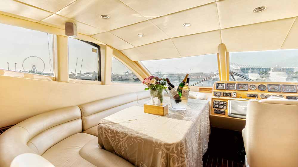 dinette and helm station at main deck of yacht